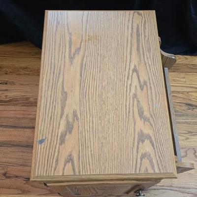 Magazine rack end table with brand new Jensen digital alarm clock and a scented candle