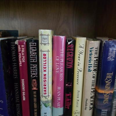Large variety of hardback books - many great authors! 2 shelves of hardbacks!
