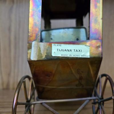 Vintage copper model T music box with movement in the hood plays Tijuana Taxi and a neat wooden sailboat