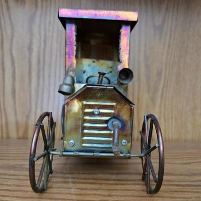 Vintage copper model T music box with movement in the hood plays Tijuana Taxi and a neat wooden sailboat