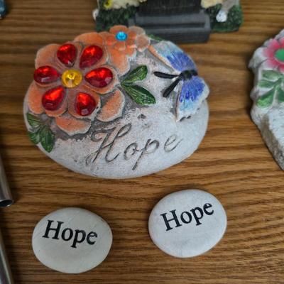 Bird houses - decorative garden stones with a backyards bird identification book