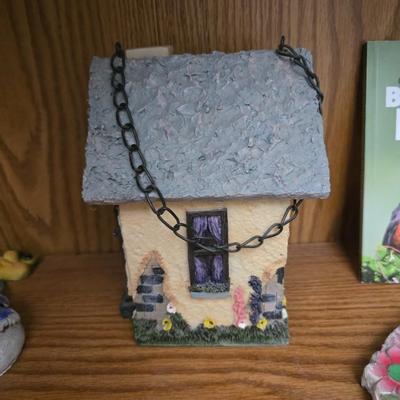 Bird houses - decorative garden stones with a backyards bird identification book