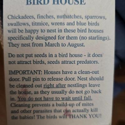 Bird houses - decorative garden stones with a backyards bird identification book
