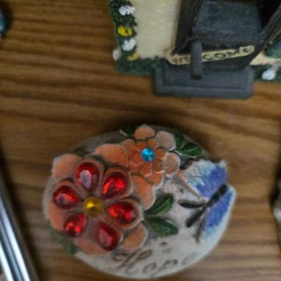 Bird houses - decorative garden stones with a backyards bird identification book