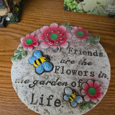 Bird houses - decorative garden stones with a backyards bird identification book