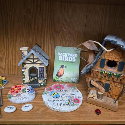 Bird houses - decorative garden stones with a backyards bird identification book