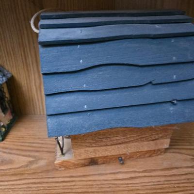 Bird houses - decorative garden stones with a backyards bird identification book