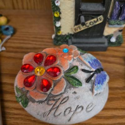 Bird houses - decorative garden stones with a backyards bird identification book