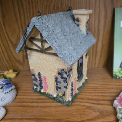 Bird houses - decorative garden stones with a backyards bird identification book