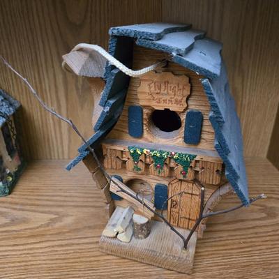 Bird houses - decorative garden stones with a backyards bird identification book