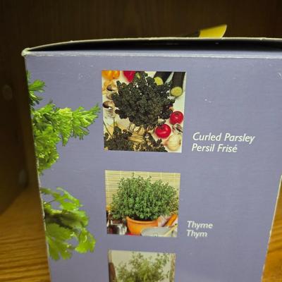 Kitchen herbs grow kit, garden sttake, mom wow planter and a small metal watering can planter