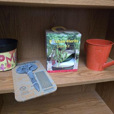 Kitchen herbs grow kit, garden sttake, mom wow planter and a small metal watering can planter