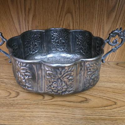 Large decorative pot metal bowl with candle and a green vase