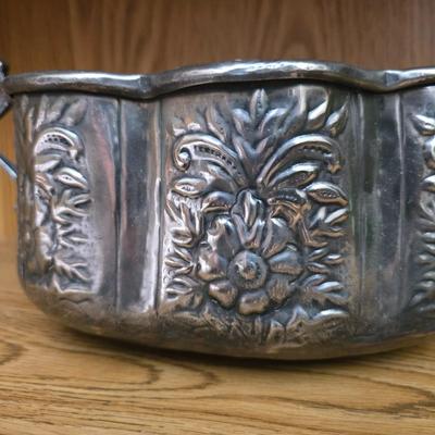 Large decorative pot metal bowl with candle and a green vase