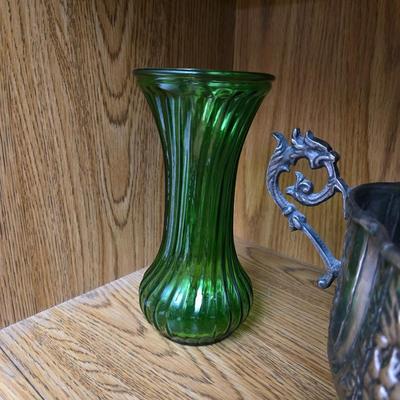 Large decorative pot metal bowl with candle and a green vase