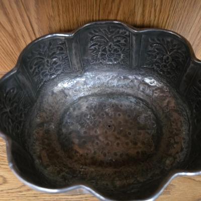 Large decorative pot metal bowl with candle and a green vase