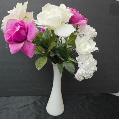 Glass vases and candle holders with boquet of faux flowers