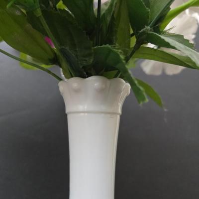 Glass vases and candle holders with boquet of faux flowers