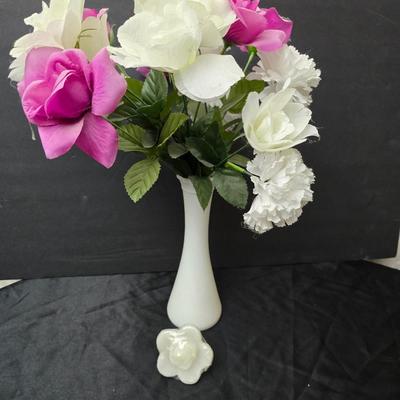 Glass vases and candle holders with boquet of faux flowers