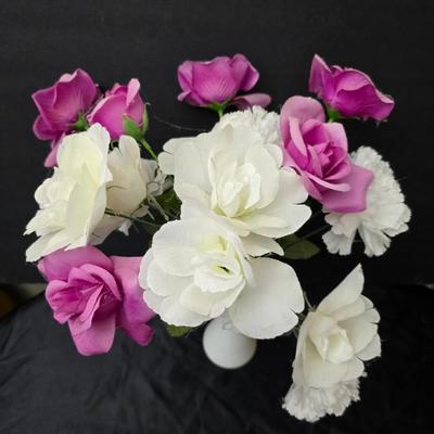 Glass vases and candle holders with boquet of faux flowers