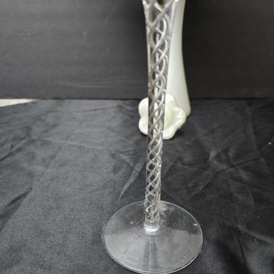 Glass vases and candle holders with boquet of faux flowers