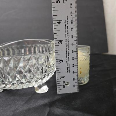 Ruby Red glass grape bowl with a smaller glass bowl and a candle