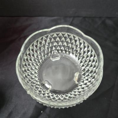 Ruby Red glass grape bowl with a smaller glass bowl and a candle