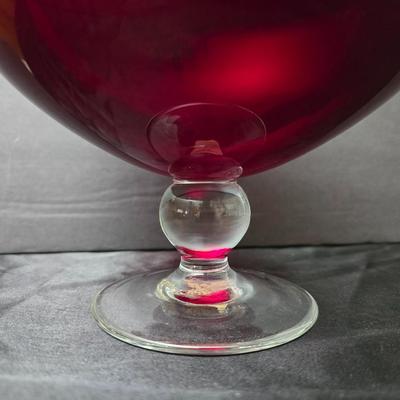 Ruby Red glass grape bowl with a smaller glass bowl and a candle