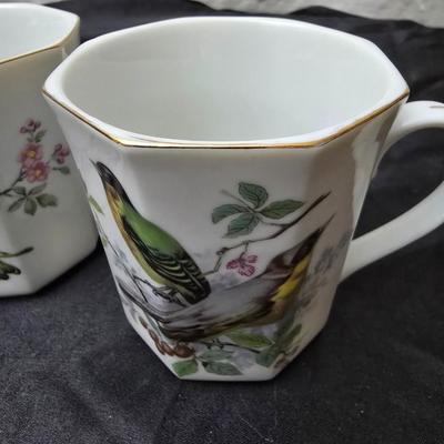 Birdhouse themed metal tea pot with four bird themed mugs - a metal tea pot trivet and a tea strainer