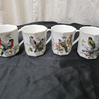 Birdhouse themed metal tea pot with four bird themed mugs - a metal tea pot trivet and a tea strainer