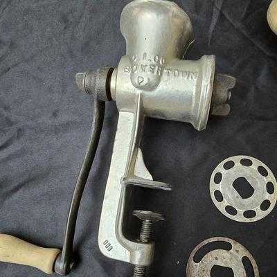 Vintage wearever aluminum strainer with stand and a Boyertown meat grinder with grinding discs
