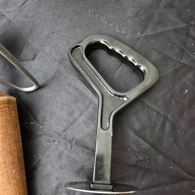 Vintage wearever aluminum strainer with stand and a Boyertown meat grinder with grinding discs