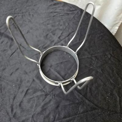 Vintage wearever aluminum strainer with stand and a Boyertown meat grinder with grinding discs