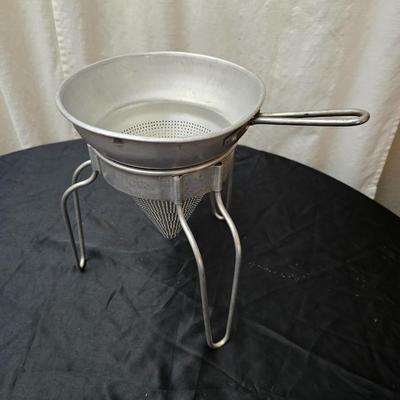 Vintage wearever aluminum strainer with stand and a Boyertown meat grinder with grinding discs