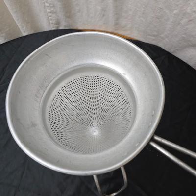 Vintage wearever aluminum strainer with stand and a Boyertown meat grinder with grinding discs