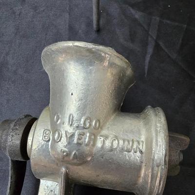 Vintage wearever aluminum strainer with stand and a Boyertown meat grinder with grinding discs