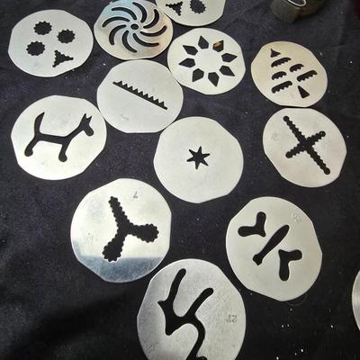 Cookies anyone? Cookie sheet with a large variety of vintage cookie cutters and a Mirror cookie press and copper Jello molds