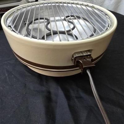 Farberware open hearth electric broiler / grill with rotisserie and a round electric grill
