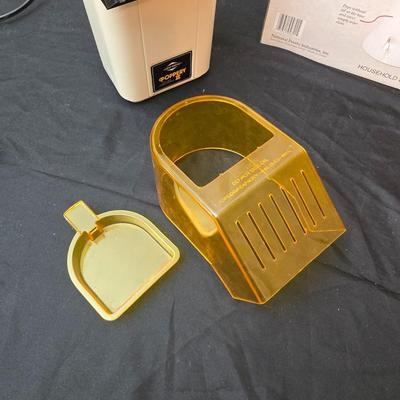 The ultimate movie set-up = Popcorn maker with popcorn bowl and condiment shakers with a toothpick container too!