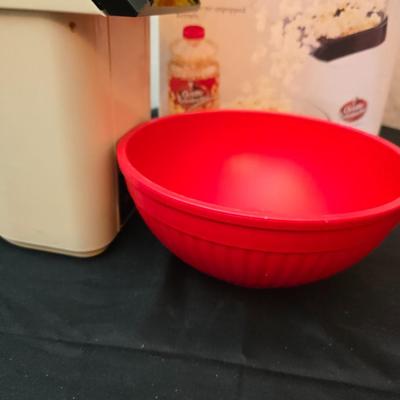 The ultimate movie set-up = Popcorn maker with popcorn bowl and condiment shakers with a toothpick container too!