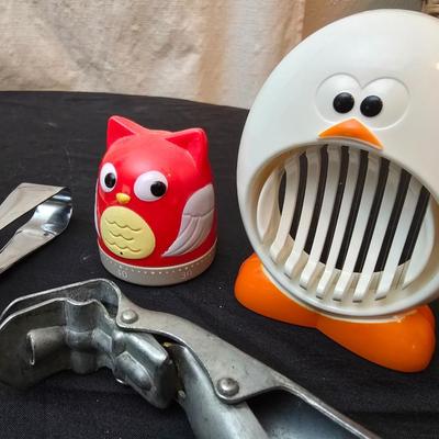 Variet of kitchen gadgets - potato peeler - graters - jar opener and more