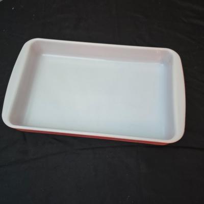 Large yellow pyrex mixing bowl with pink Pyrex cake dish