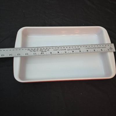 Large yellow pyrex mixing bowl with pink Pyrex cake dish