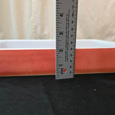 Large yellow pyrex mixing bowl with pink Pyrex cake dish