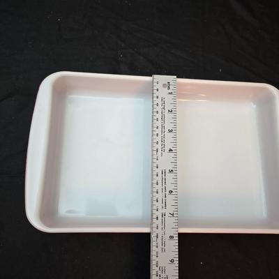 Large yellow pyrex mixing bowl with pink Pyrex cake dish