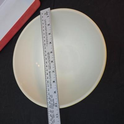Large yellow pyrex mixing bowl with pink Pyrex cake dish