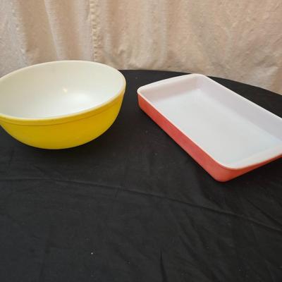 Large yellow pyrex mixing bowl with pink Pyrex cake dish
