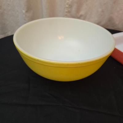 Large yellow pyrex mixing bowl with pink Pyrex cake dish