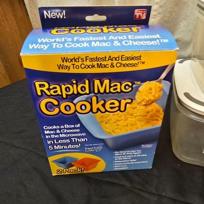 Plastic food storage containers with a Rapid Mac cooker - Nostalgia mini 7 egg cooker - a tiered serving tray and a new knife