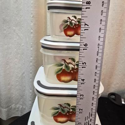Plastic food storage containers with a Rapid Mac cooker - Nostalgia mini 7 egg cooker - a tiered serving tray and a new knife